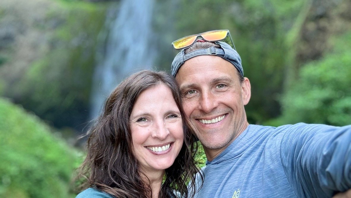 Jarod and Rachel together in front of a waterfall