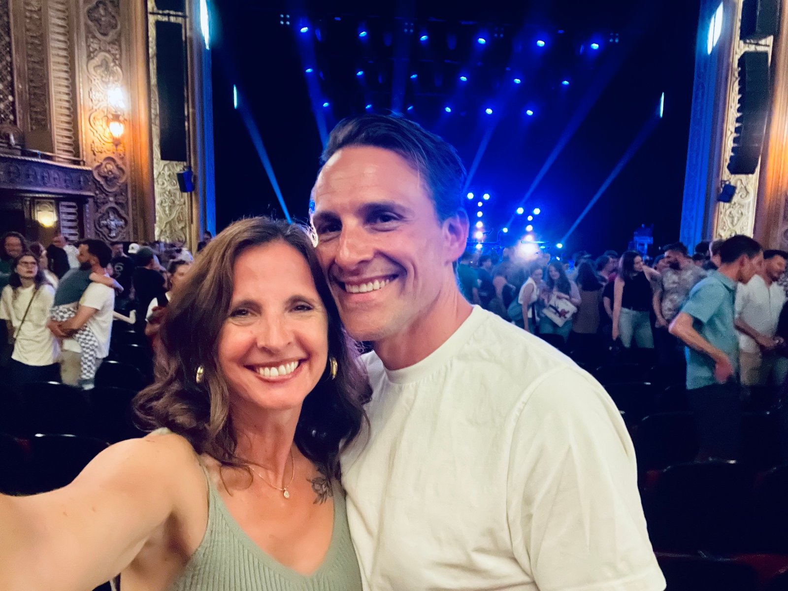 Jarod and Rachel smiling together at a live concert